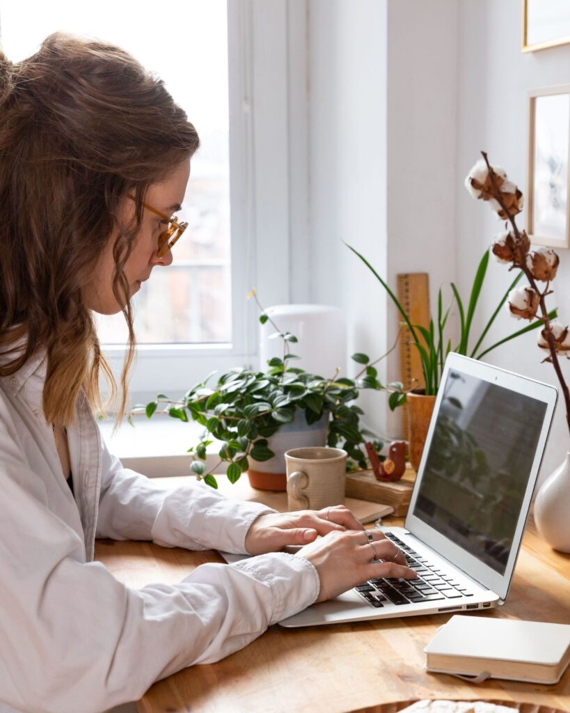Entrepreneur works on laptop at her desk