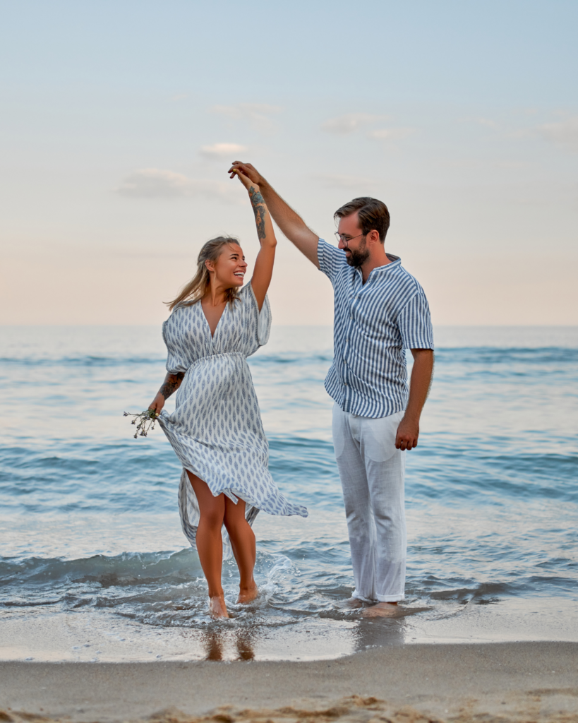 Man and woman dancing on the beach
